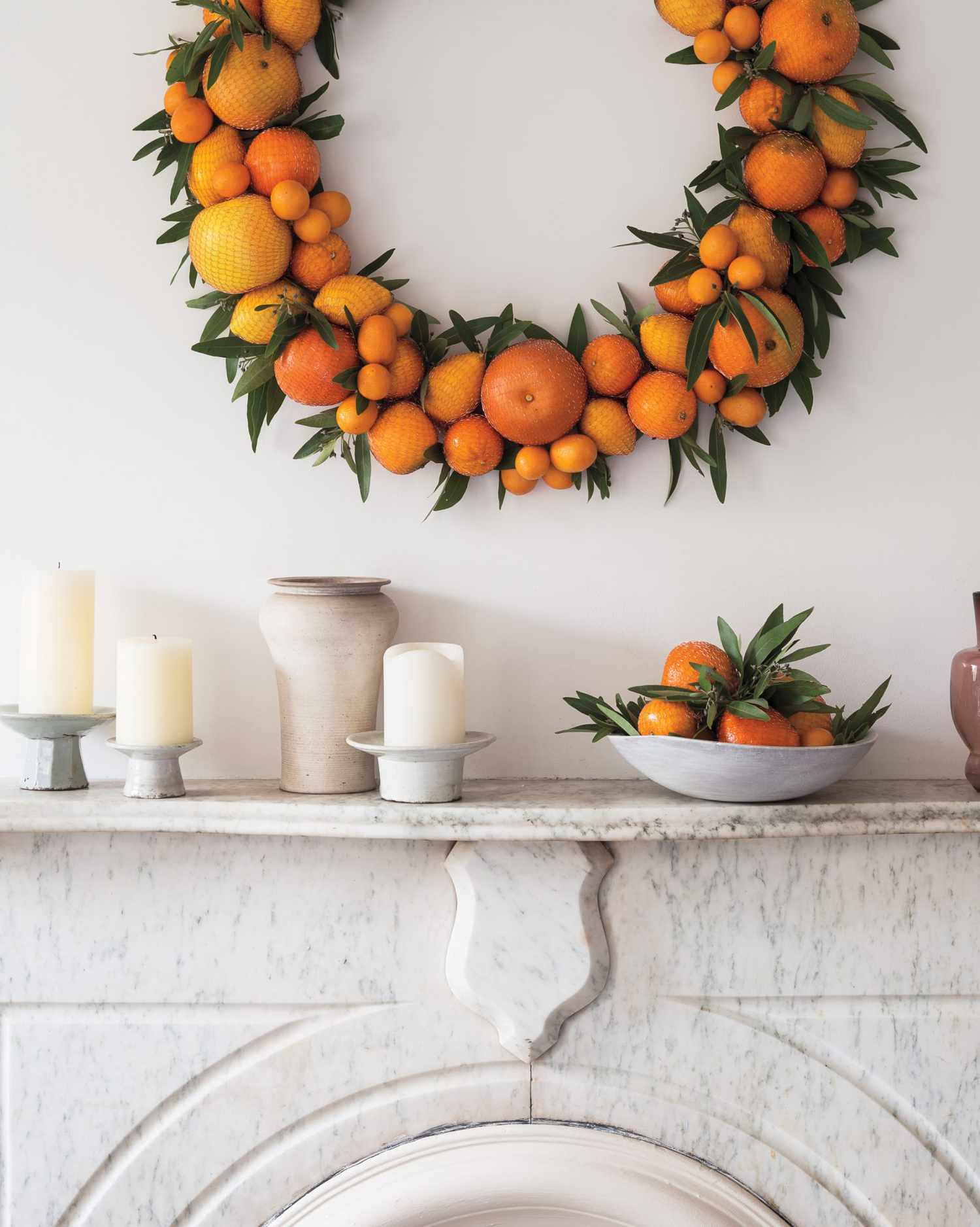 citrus wreath on a marble mantel