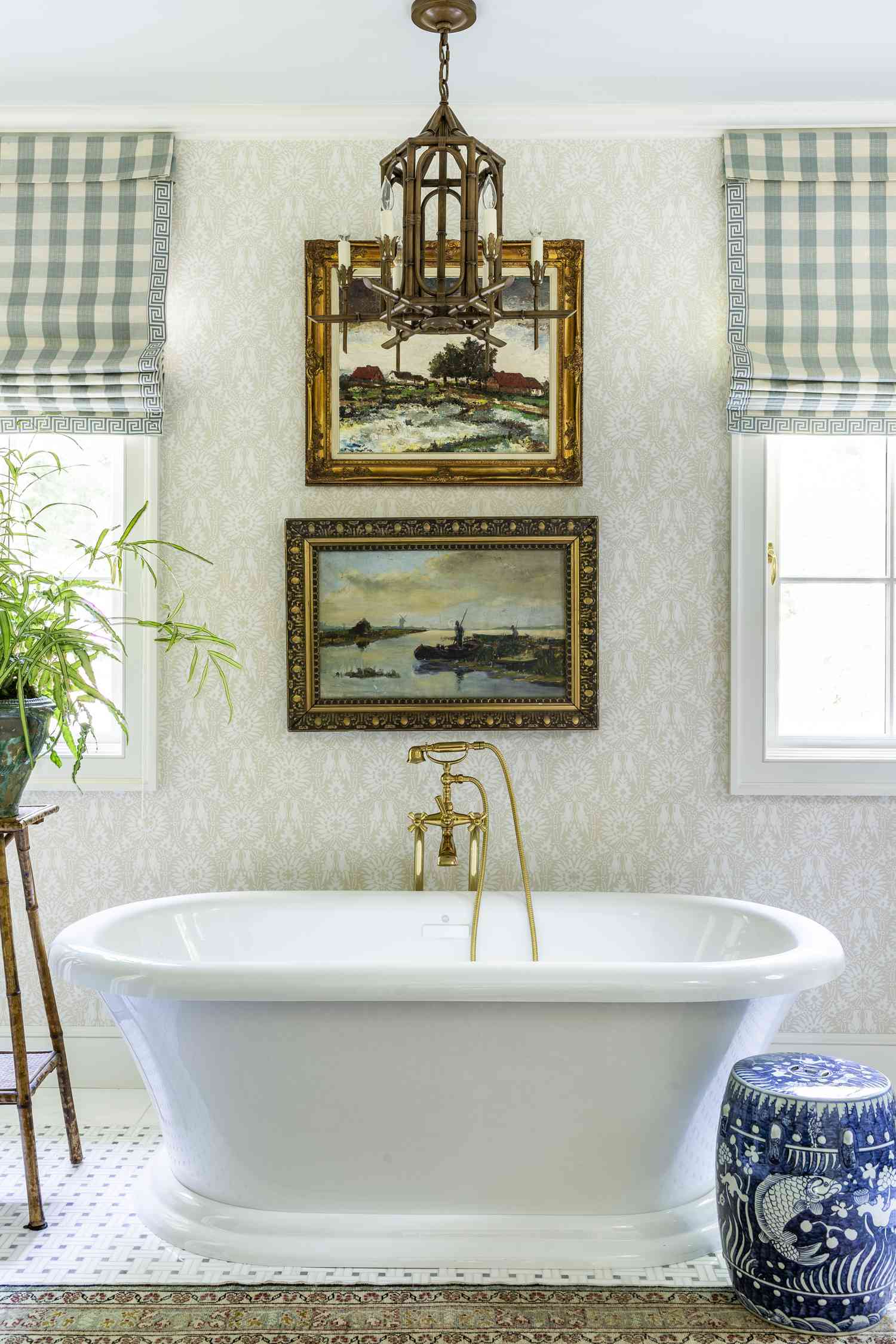 Bathroom with vintage artwork and buffalo check curtains