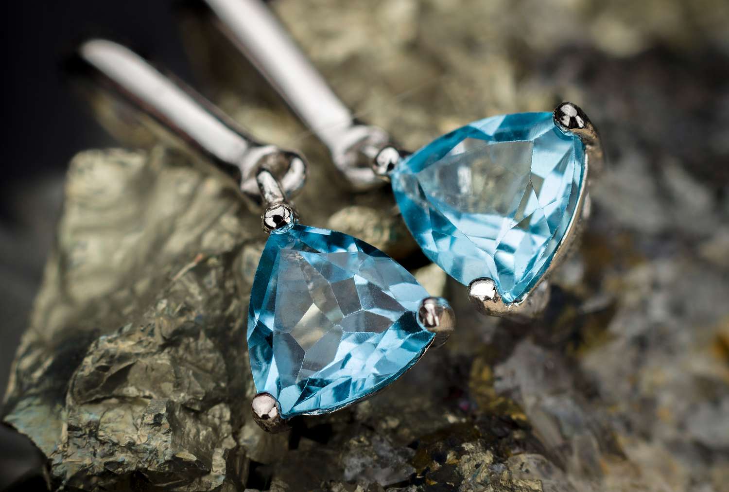 Aquamarine earrings on a textured background