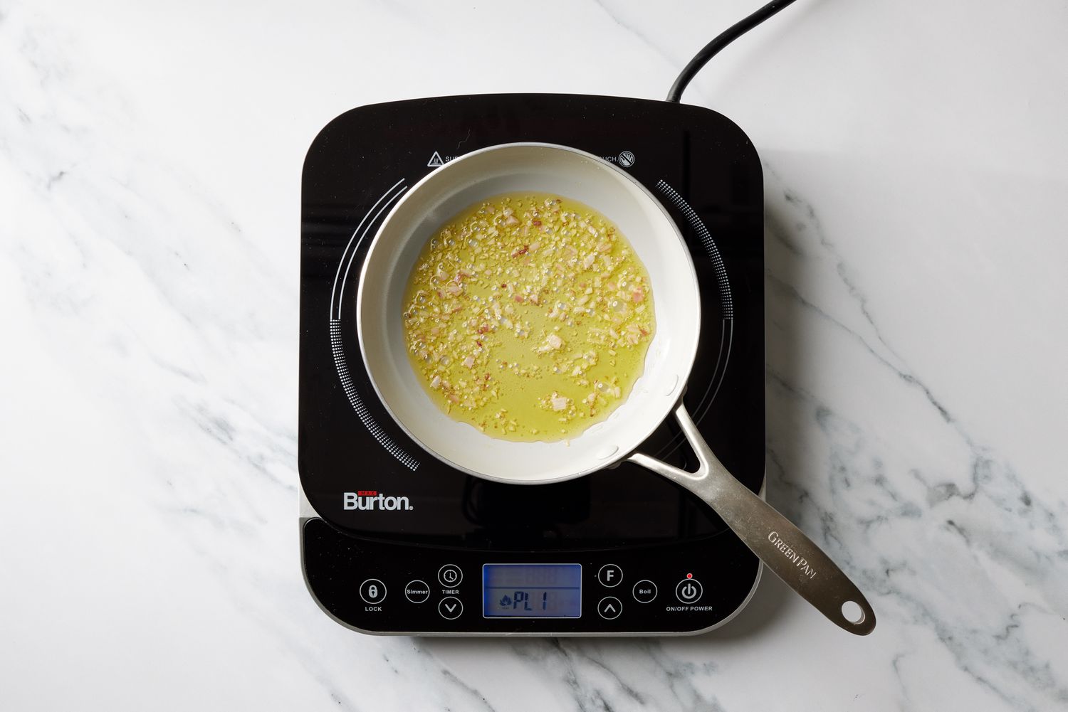 Oil and garlic in pan