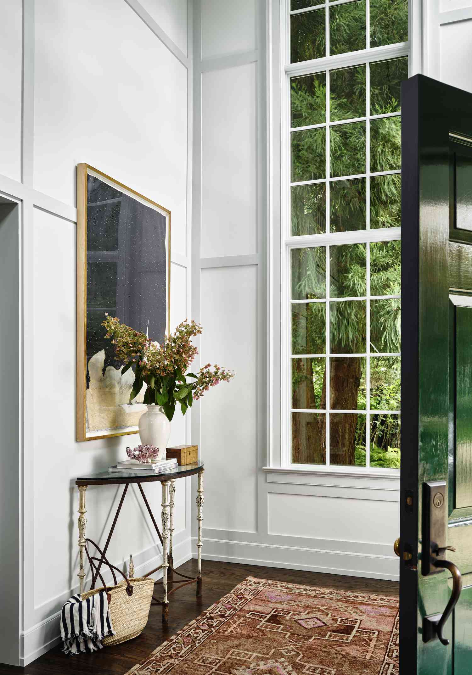 window adjacent gray and white paneling