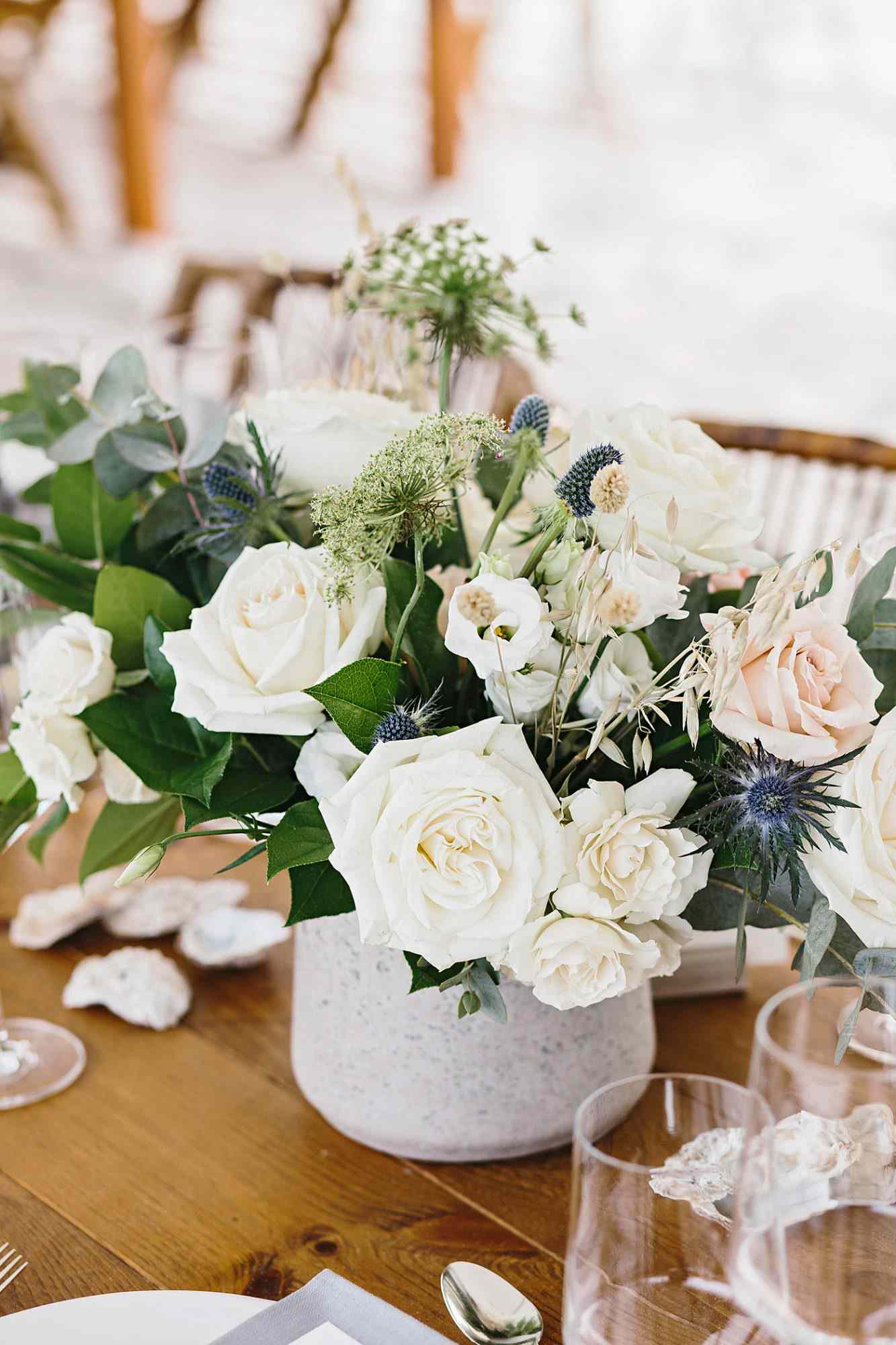 white rose wedding centerpiece on table