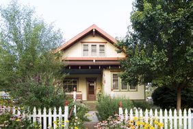 Bungalow House with White Picket Fence