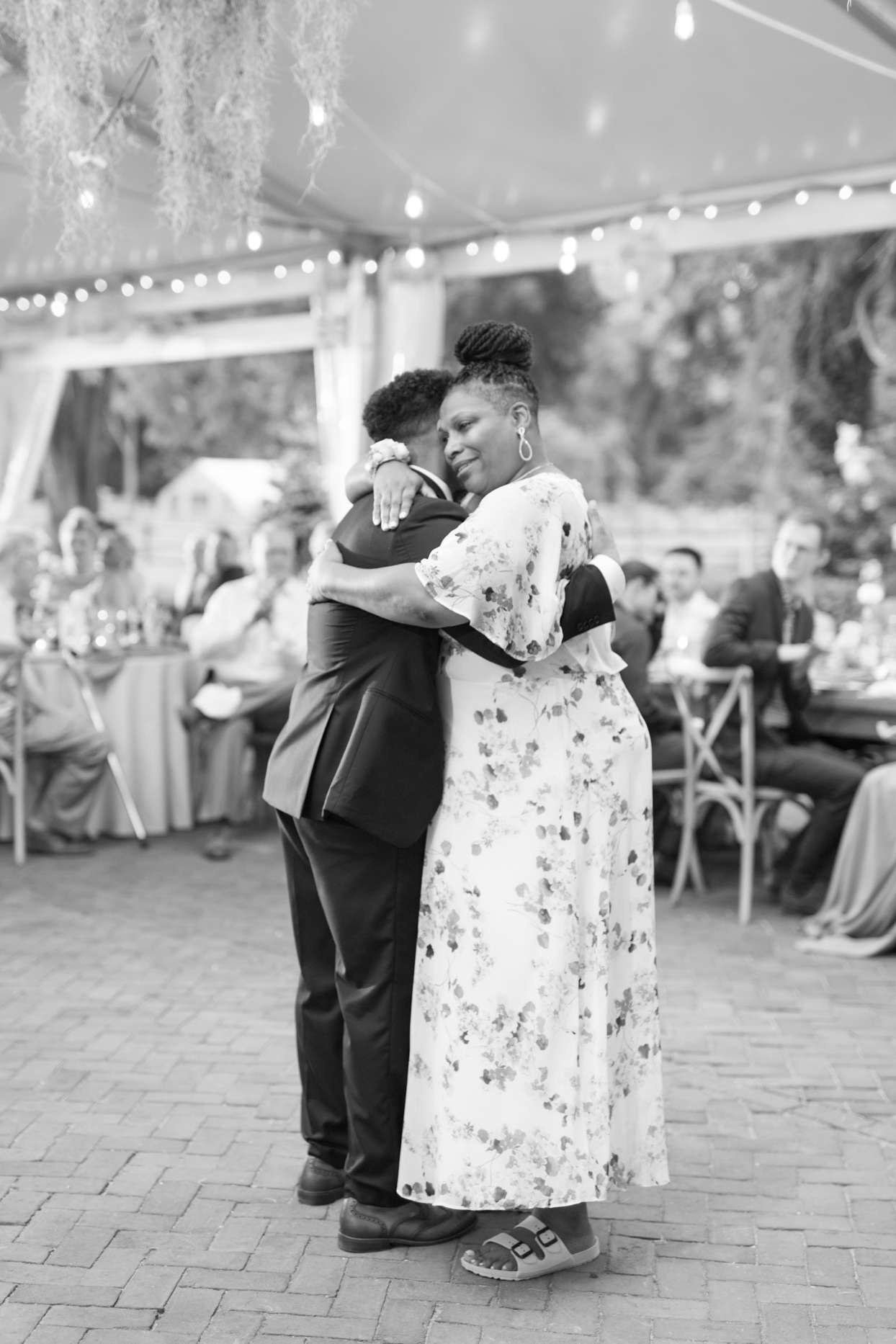 mother and groom hugging during wedding dance