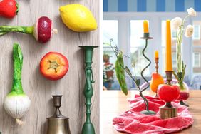 A creative arrangement of fruits and vegetables paired with candlesticks designed to imitate candlestick holders