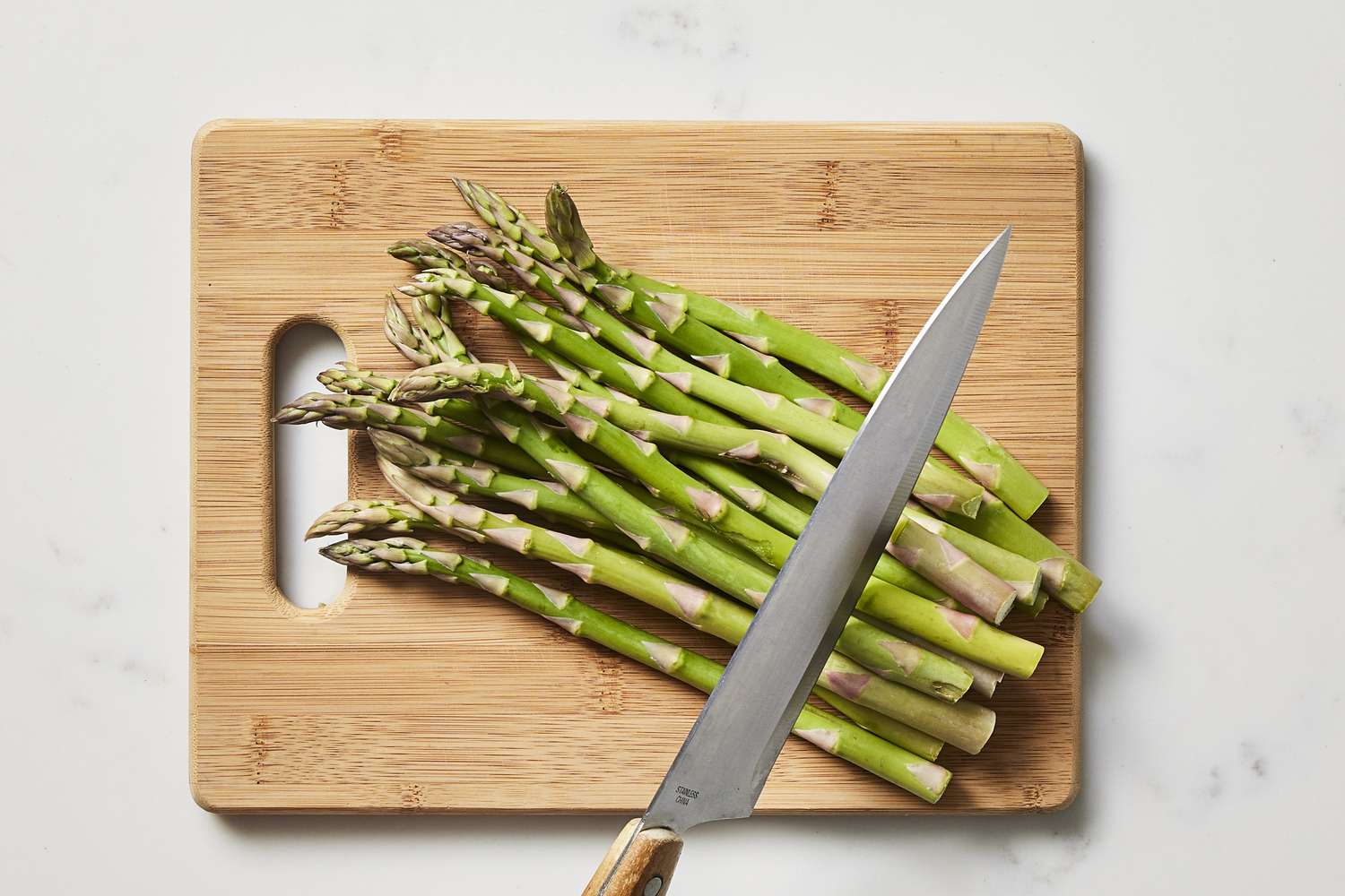 Asparagus on cutting board