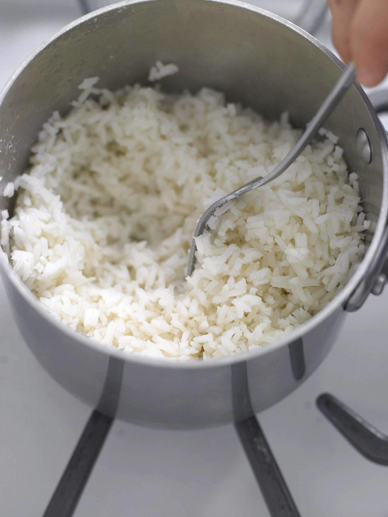 perfect white rice in pan spoon