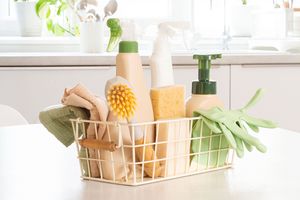 Cleaning caddy with cleaning products in kitchen