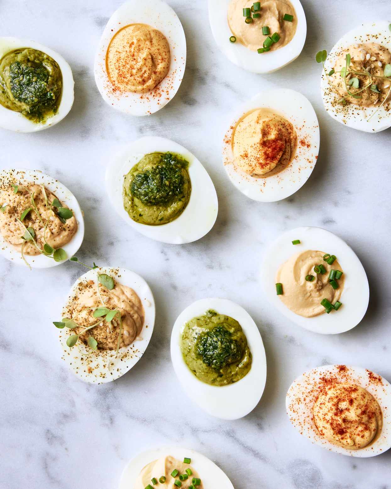 four variations of rich deviled eggs