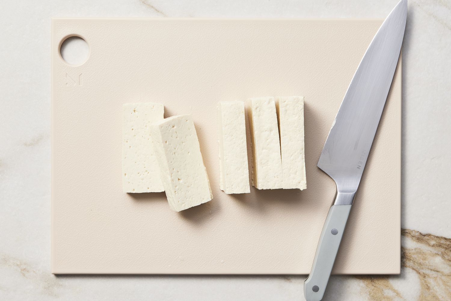 Sliced tofu on cutting board