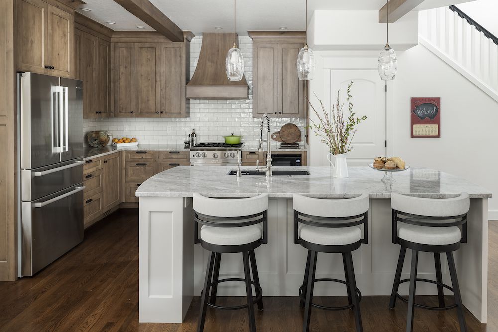 Kitchen with white kitchen island and wood kitchen cabinets