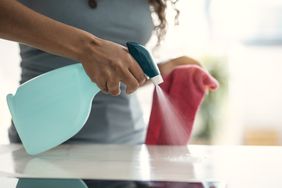 spray bottle being used on surface