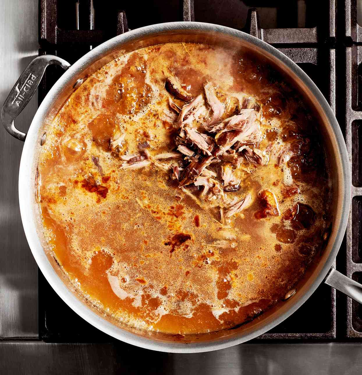 cut up turkey parts and broth added to roasting pan