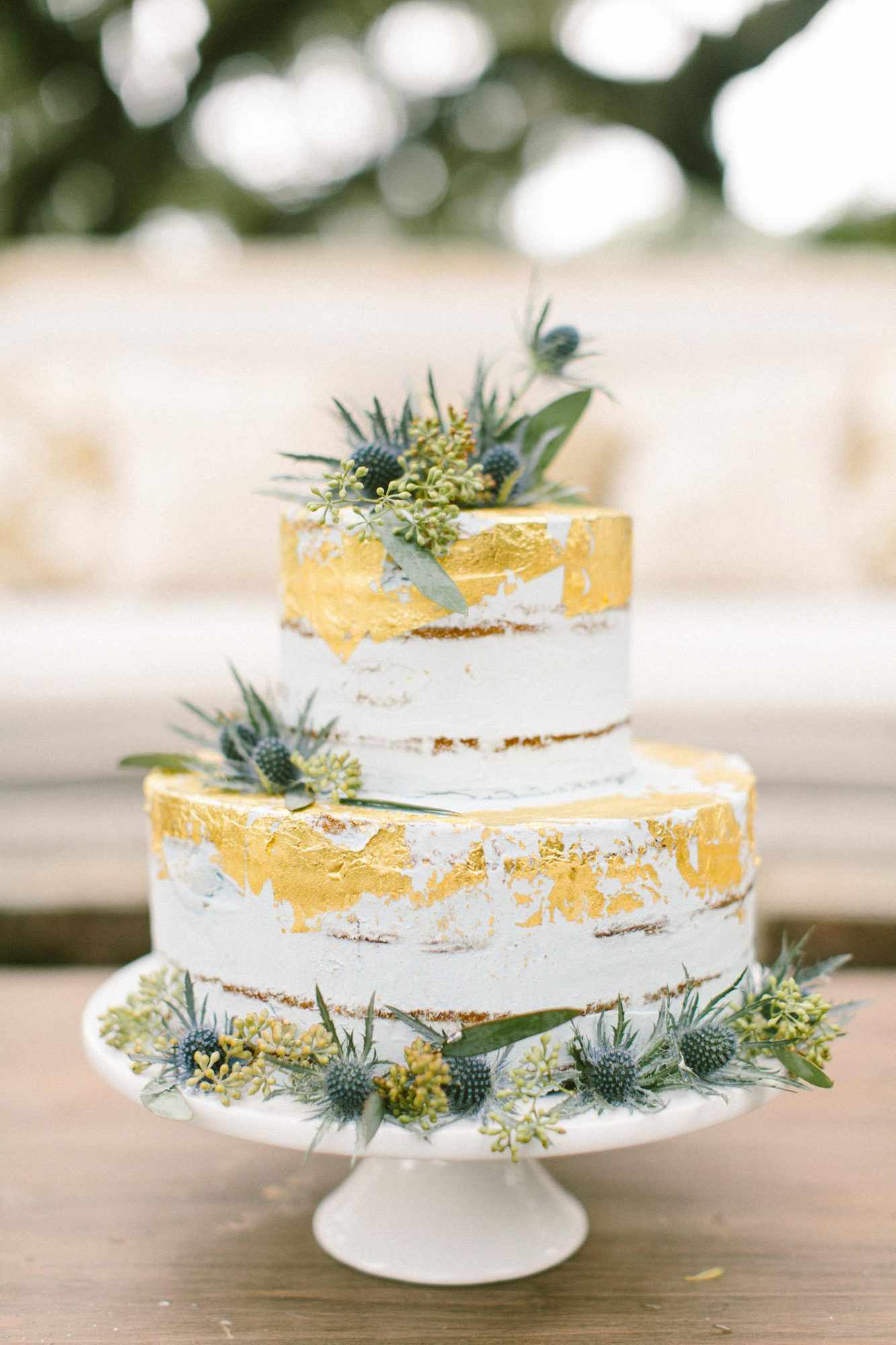 naked wedding cake gold leaf