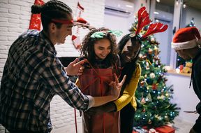 People playing a game at a Christmas party
