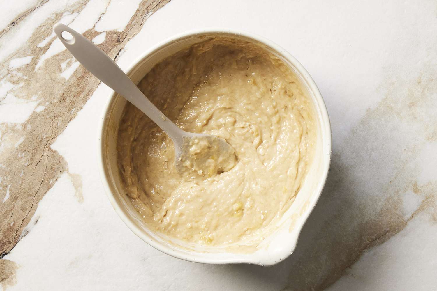 Dough in bowl with spoon