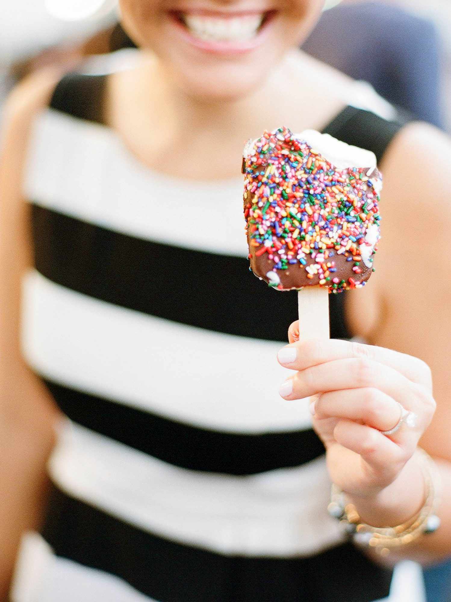 woman holding ice cream pop