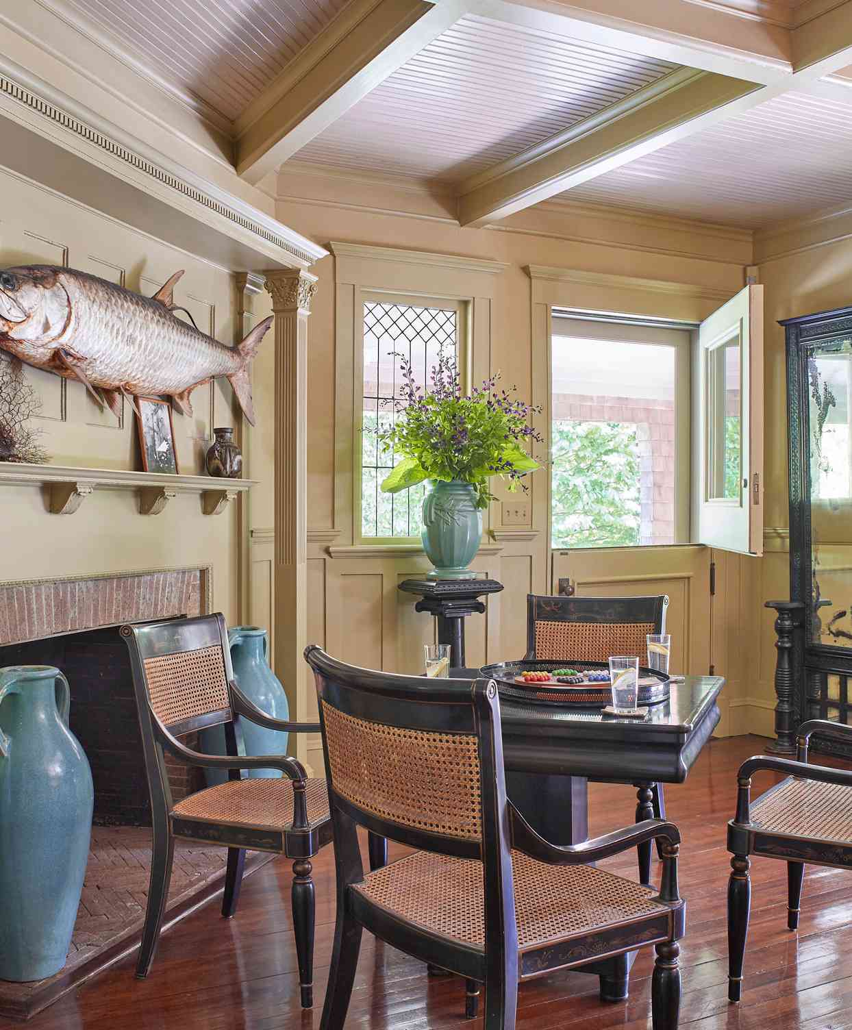entrance hall fireplace and antique game table