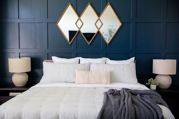 mirrors against wall paneling in bedroom 