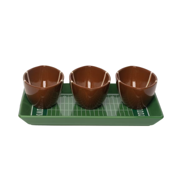 Three brown bowls on a green tray