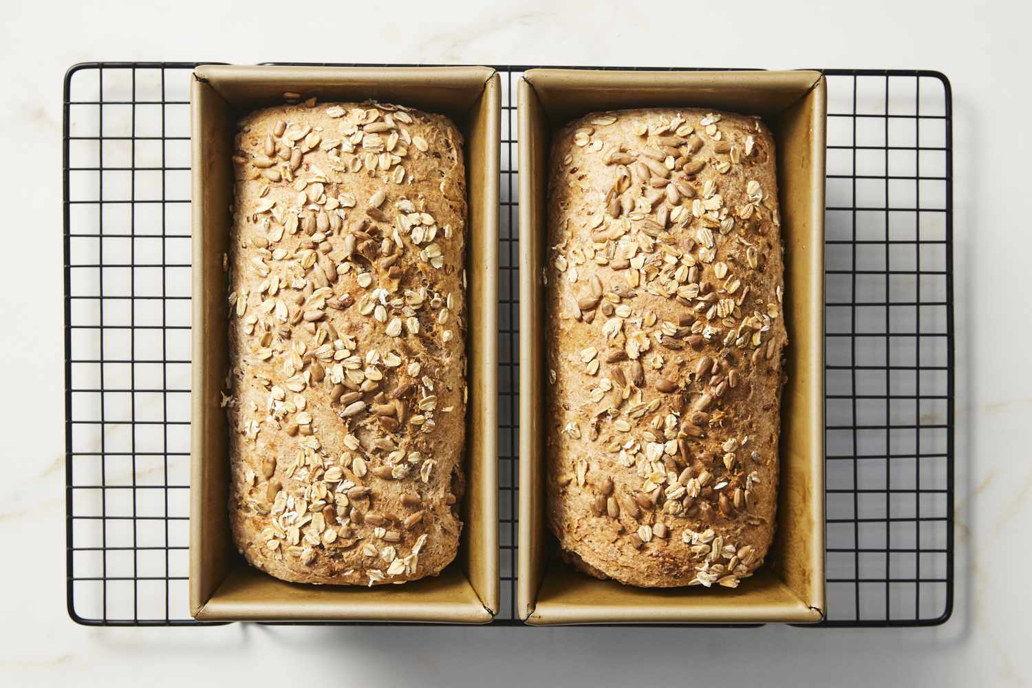 Baked multigrain bread cooling on wire rack