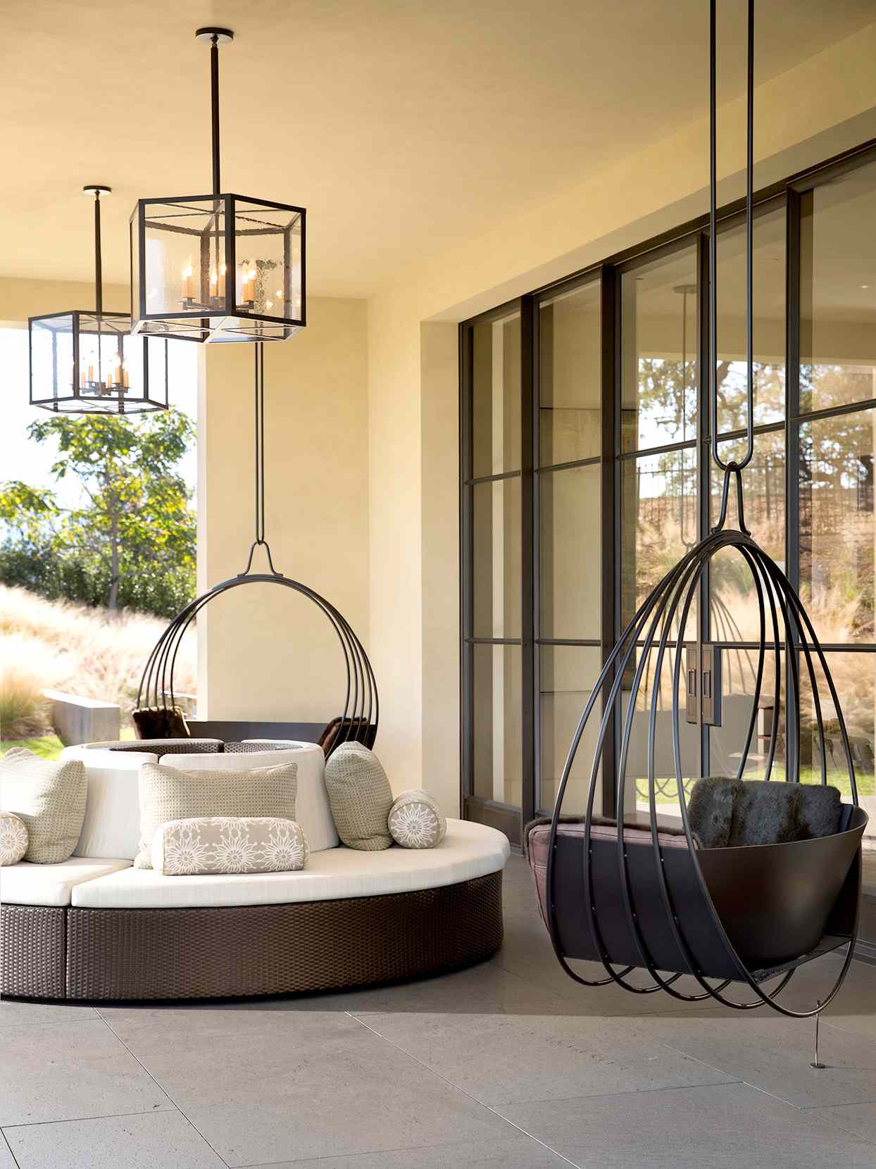 Outdoor seating with round couch and hanging chair