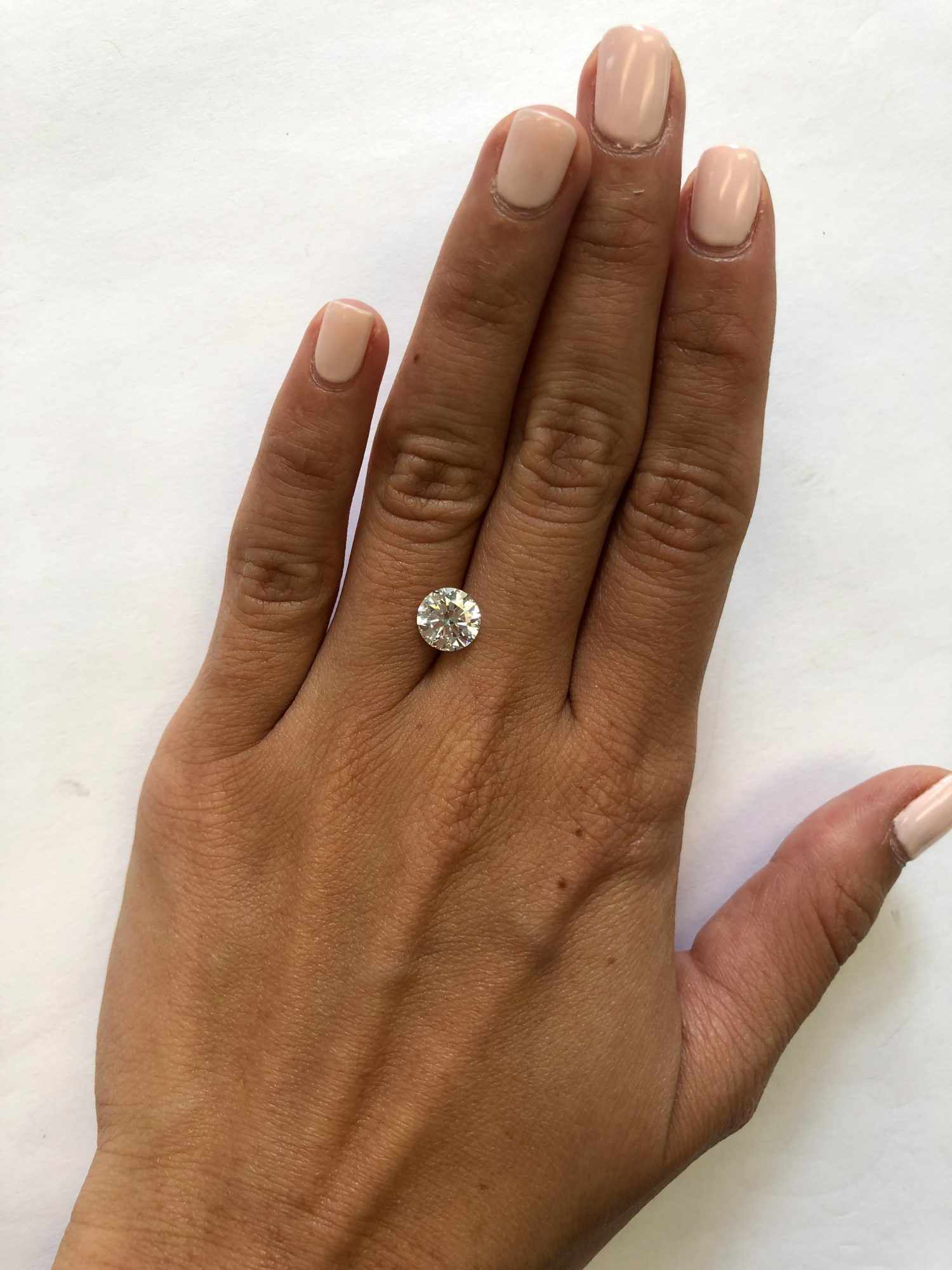 hand with 1.5 carat diamond