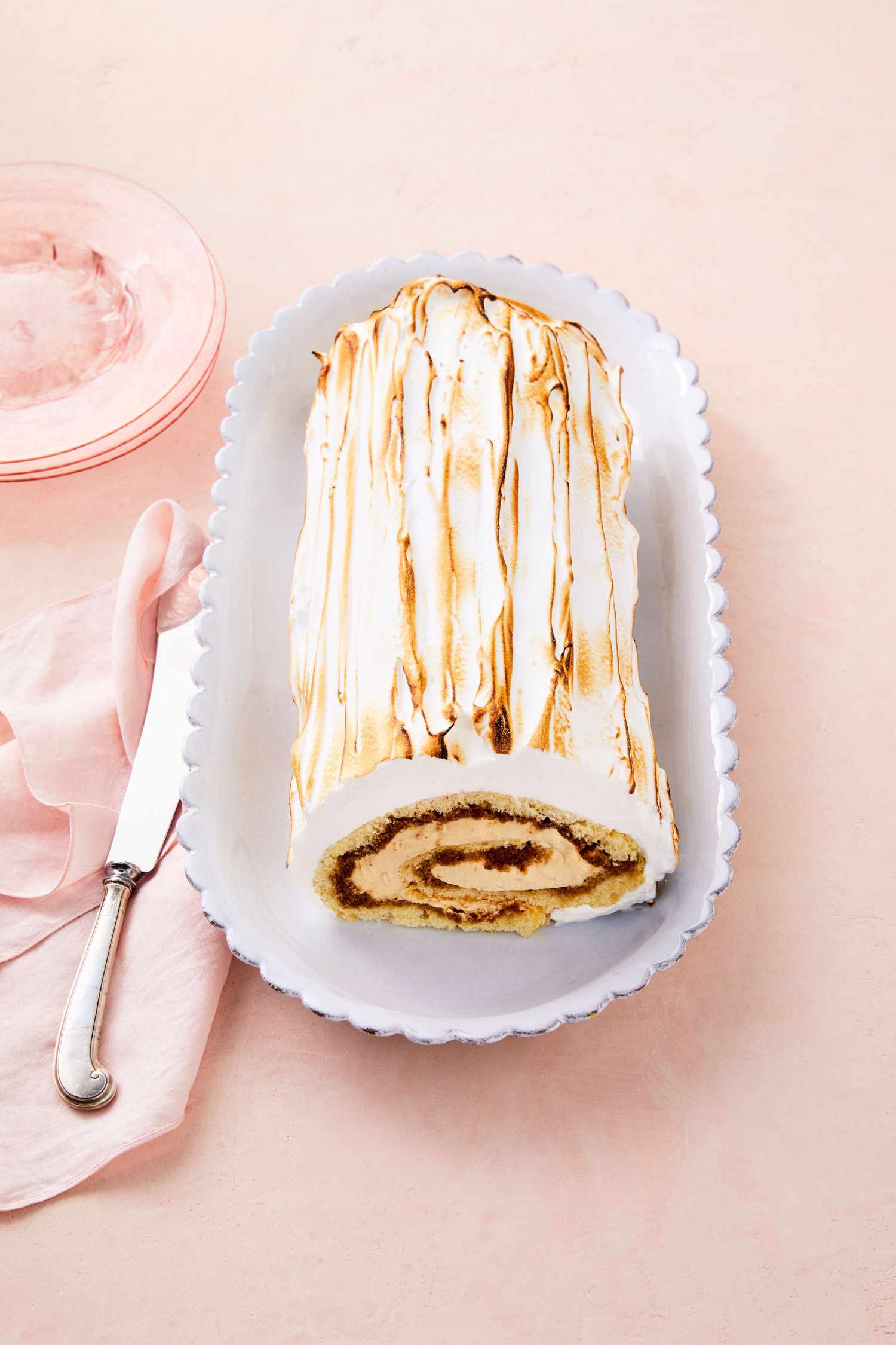 coffee caramel swiss roll on white plate