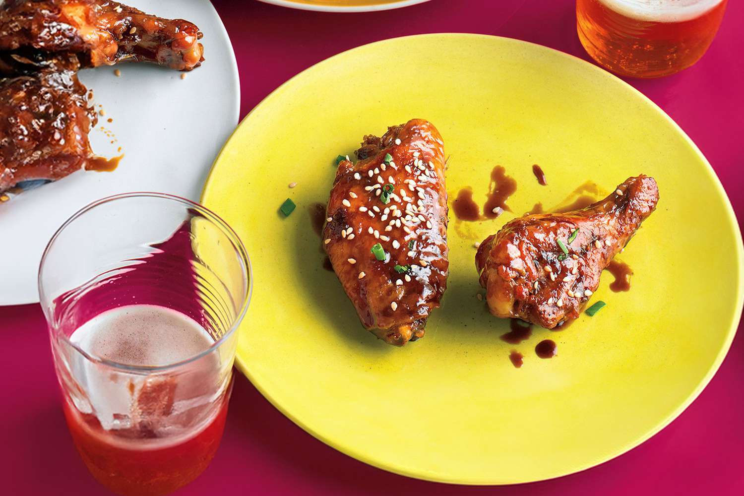 Sweet and spicy chicken wings on plate with sesame