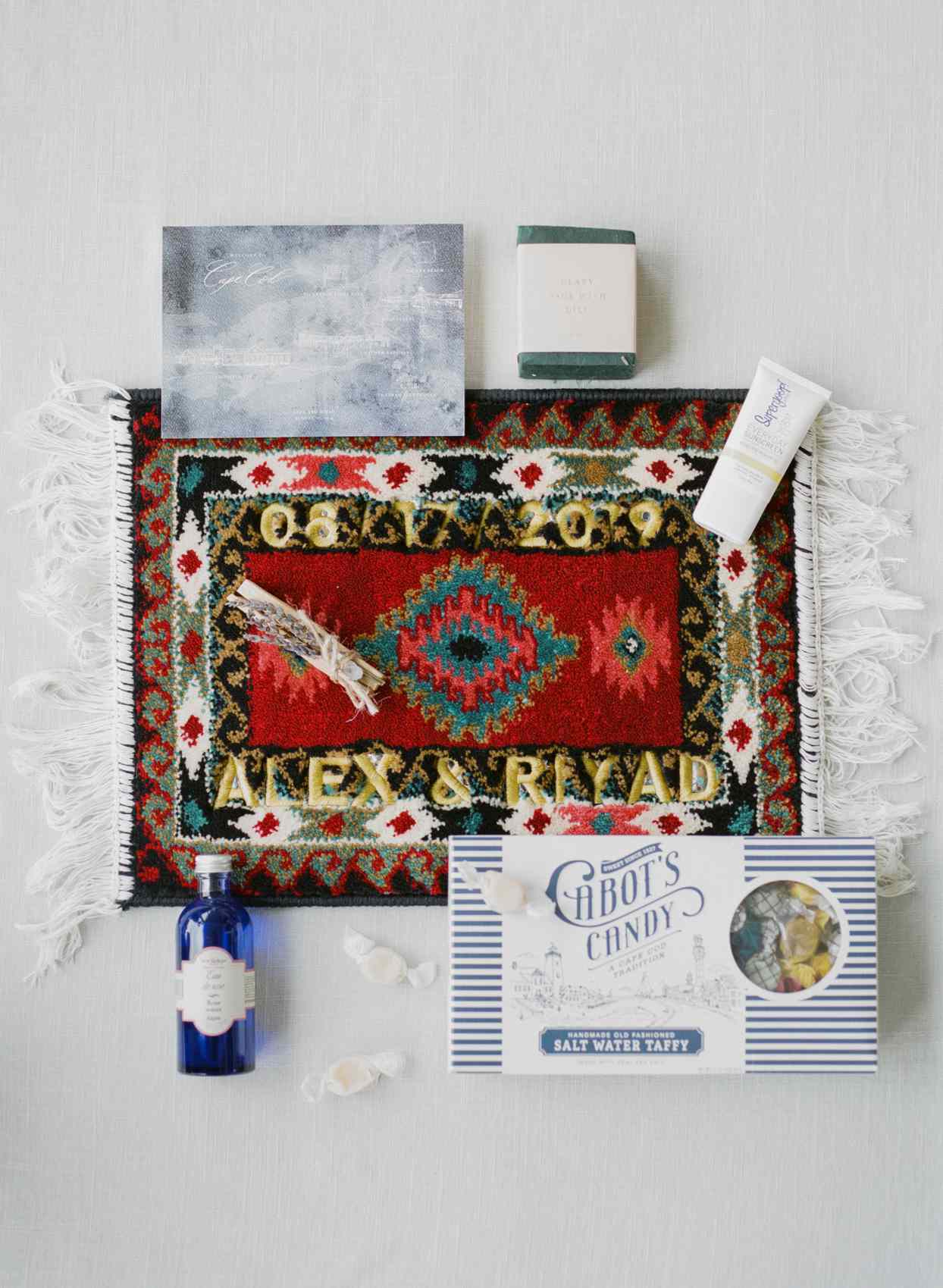 wedding welcome box with taffy, rose water, rug, rug, soap, sunscreen, and map