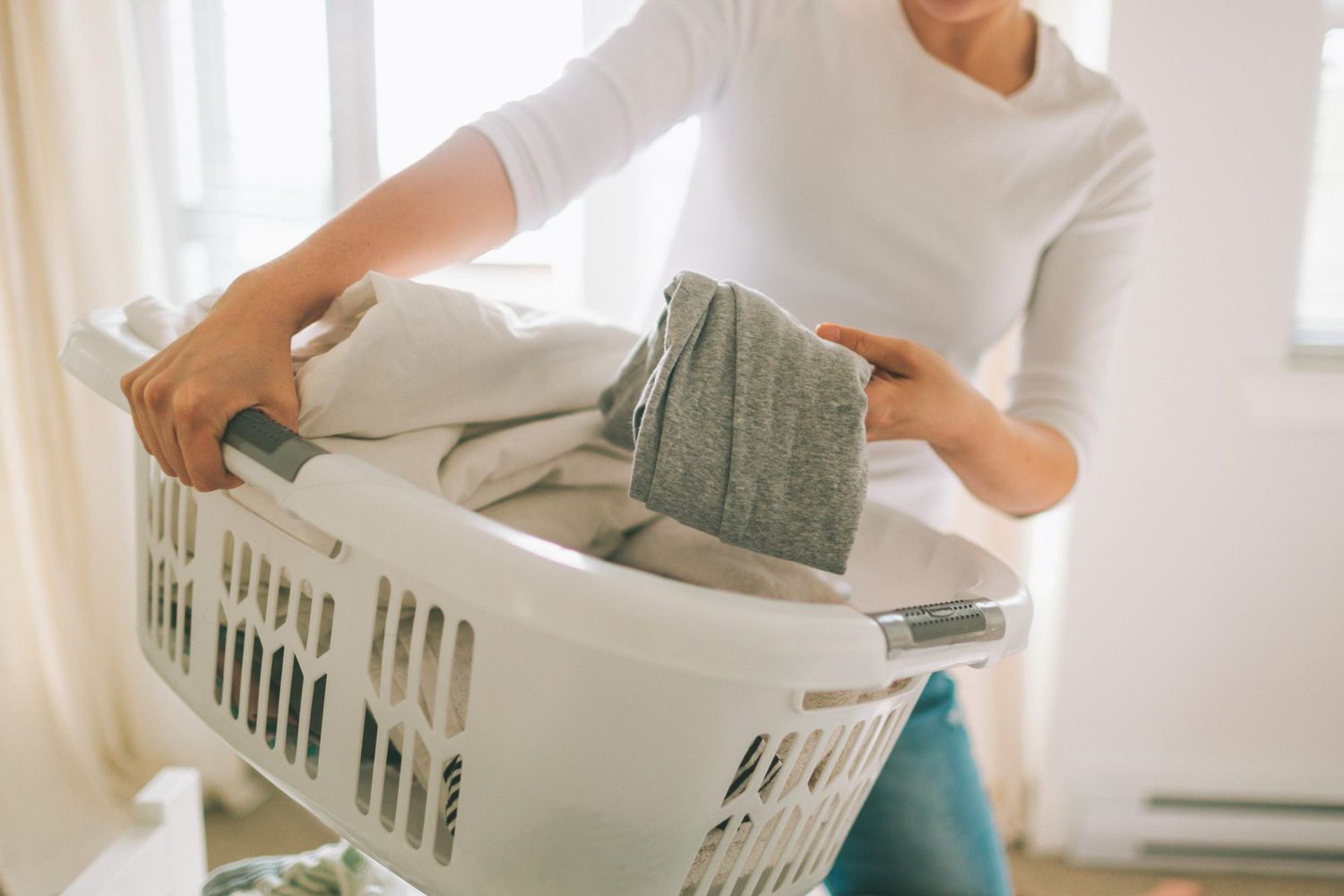 Midsection Of Woman Doing Household Chores At Home