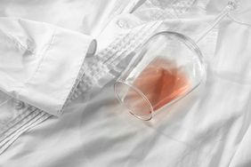 A spilled glass of wine on a white shirt