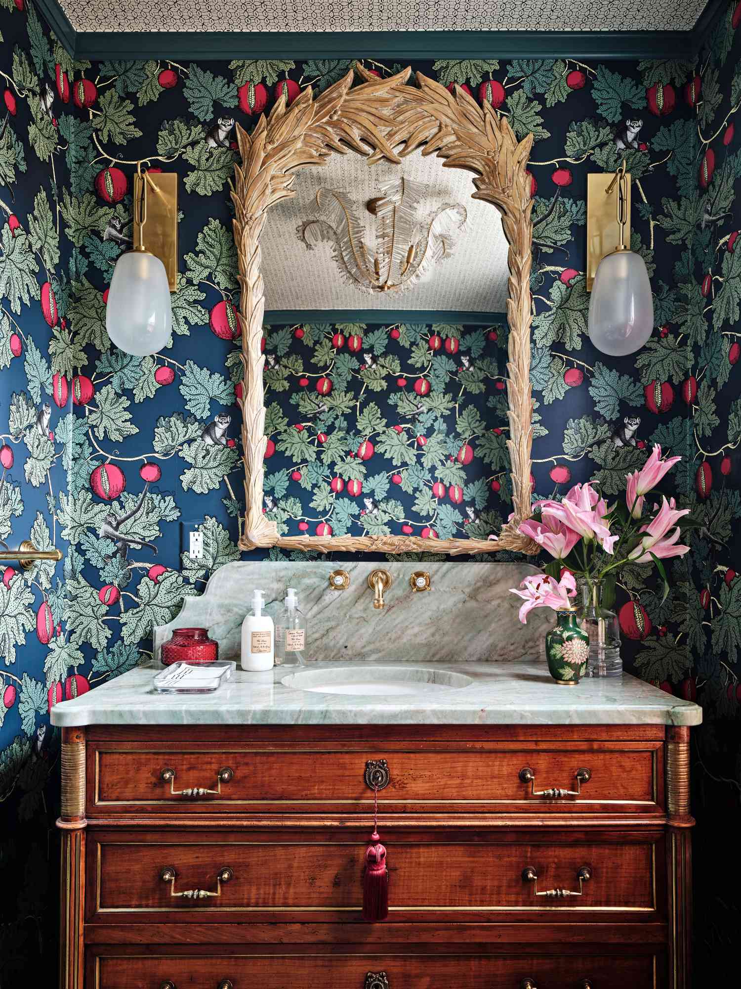 fun wallpaper with ornate bathroom mirror