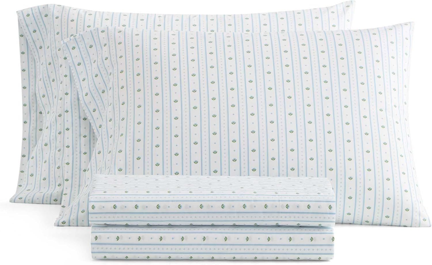 A set of patterned bed sheets including two pillows and folded sheets displayed