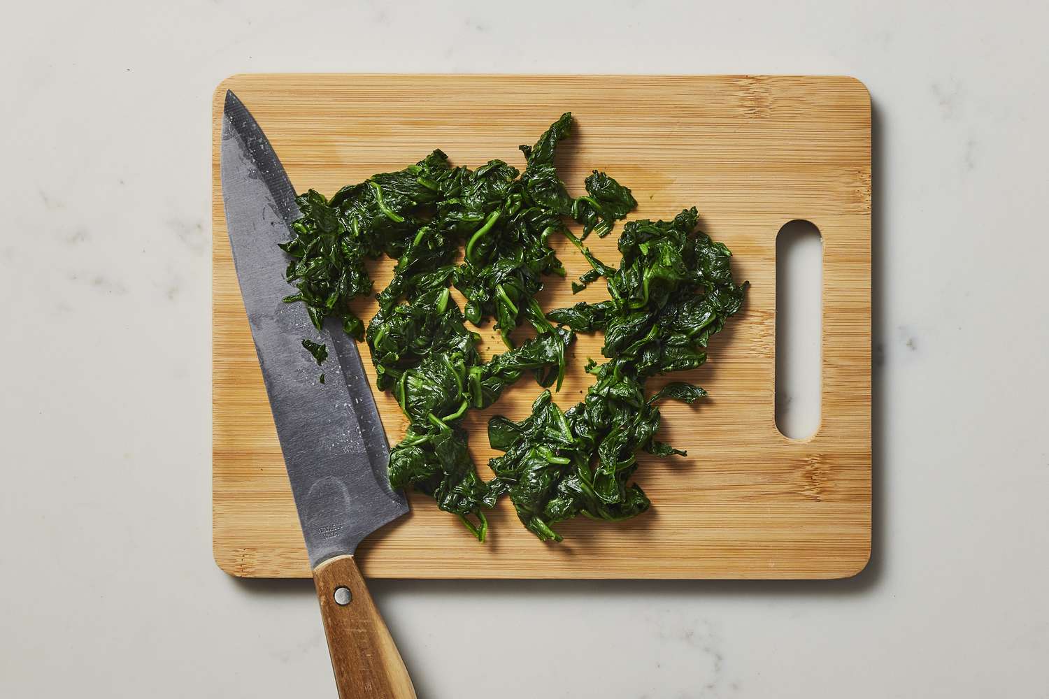 Chopped spinach on cutting board
