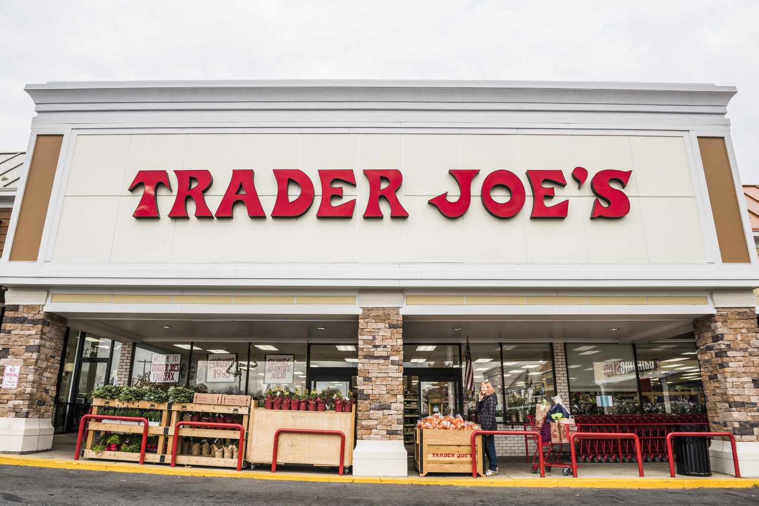The exterior view of a Trader Joes store with its sign above the entrance