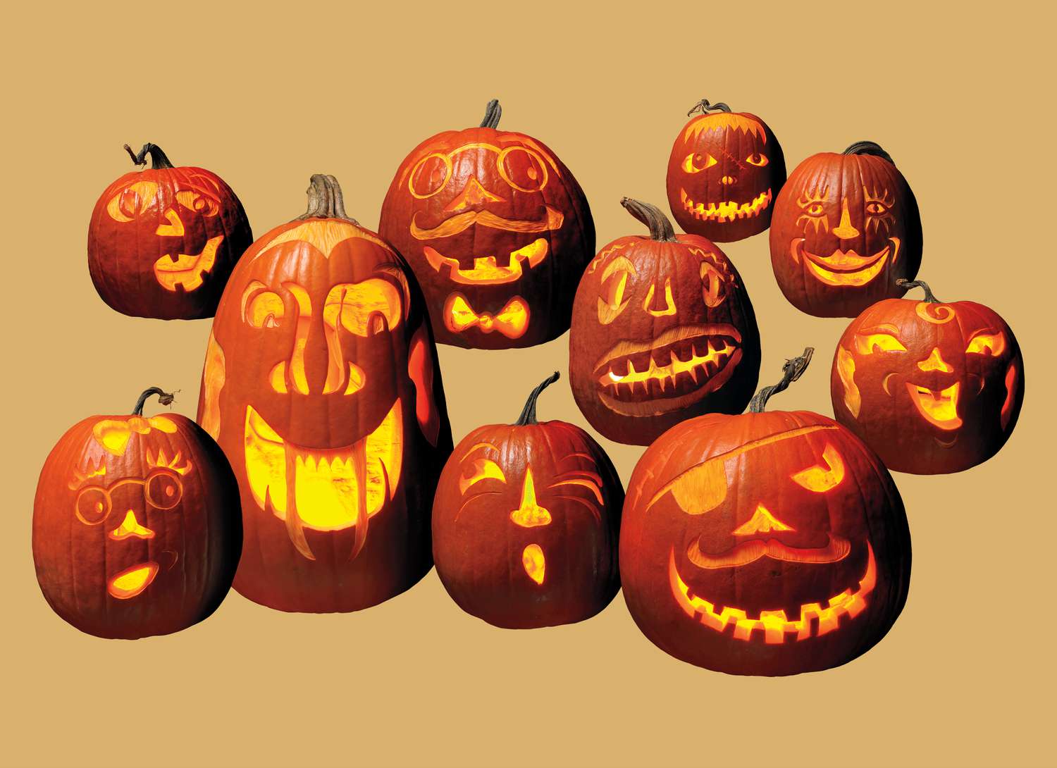 multiple jack-o-lanterns on an orange background
