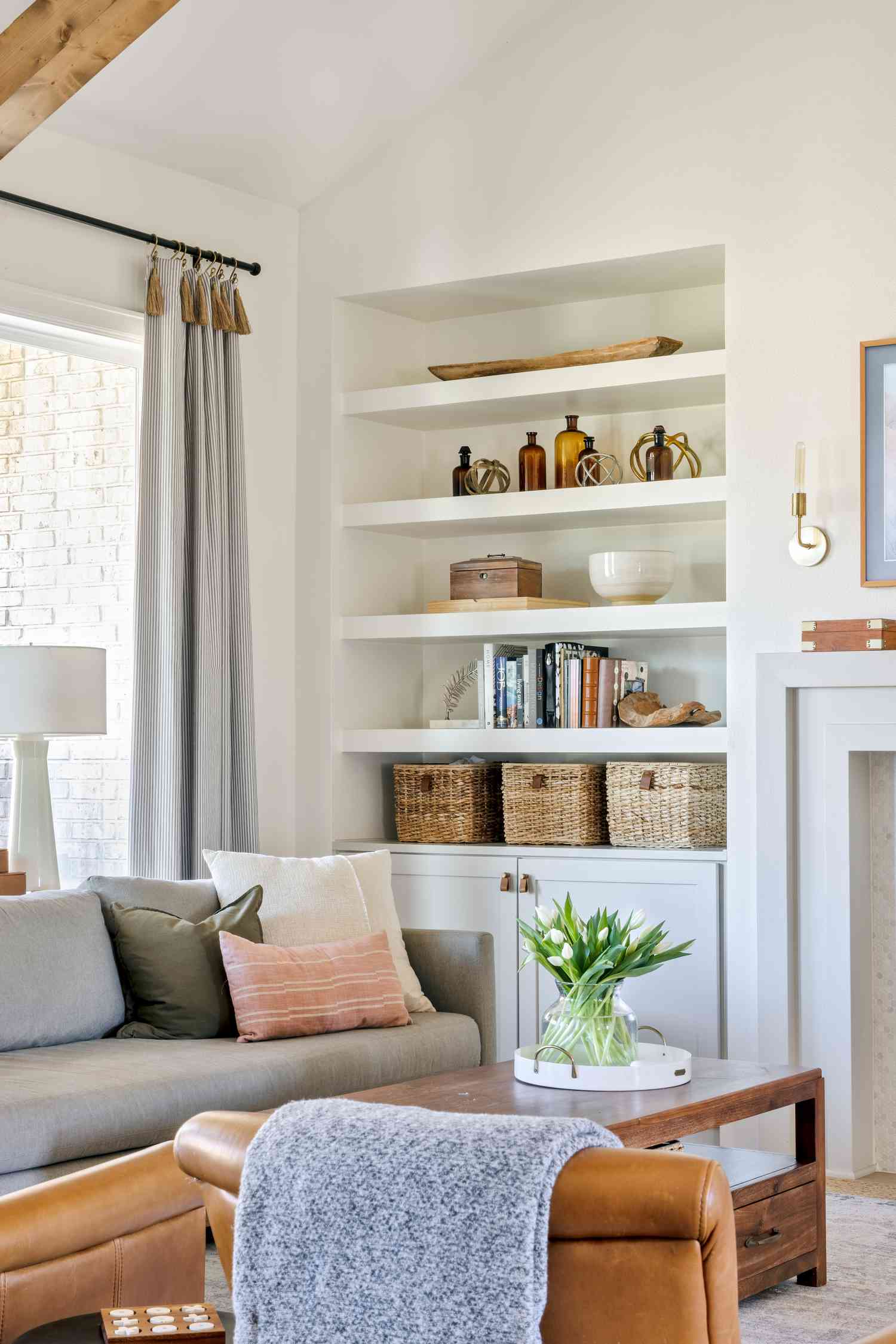 a white living room with a bookshelf
