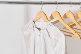 Silk top hanging from hanger