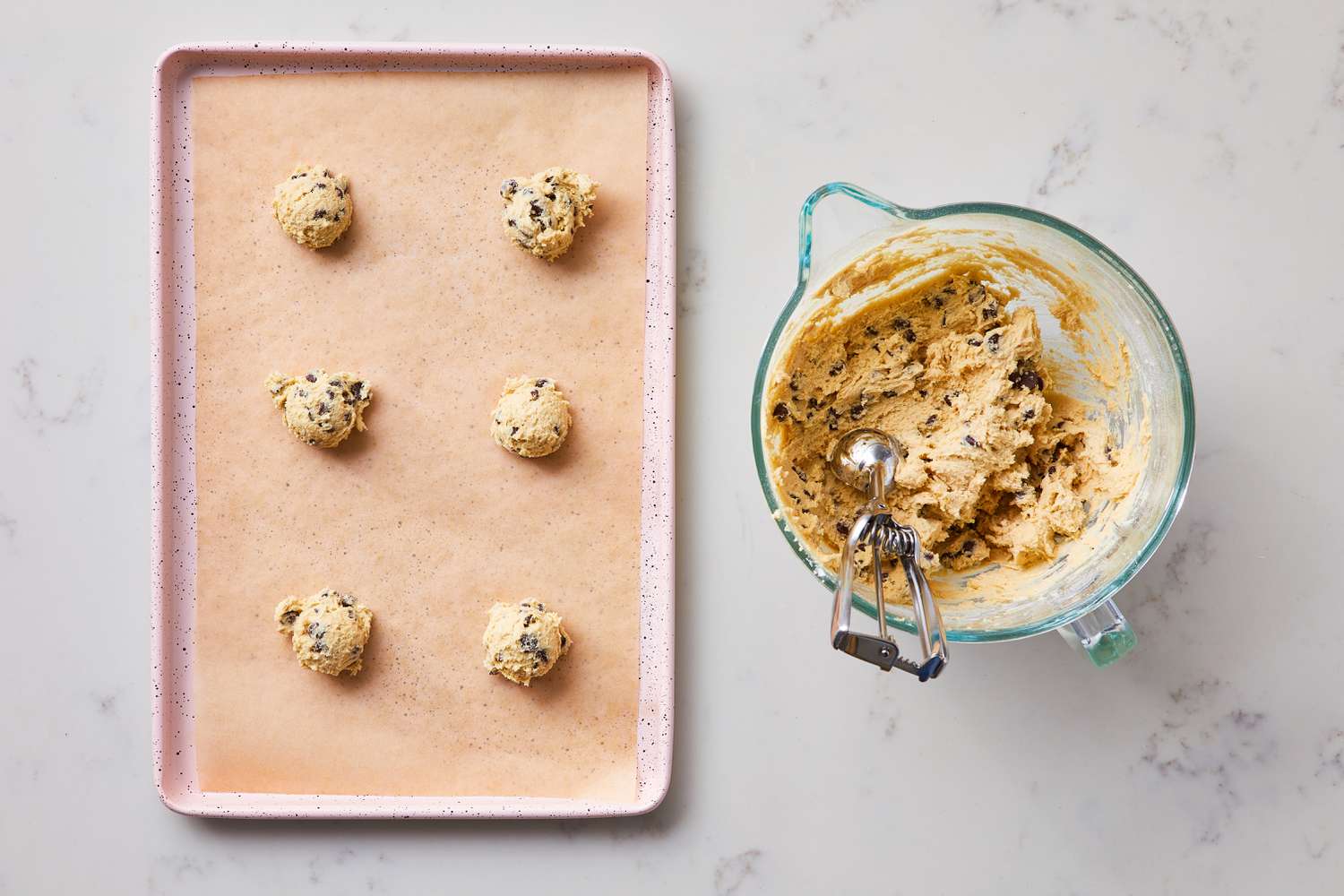 Portion Soft and Chewy Chocolate Chip cookies on baking sheet