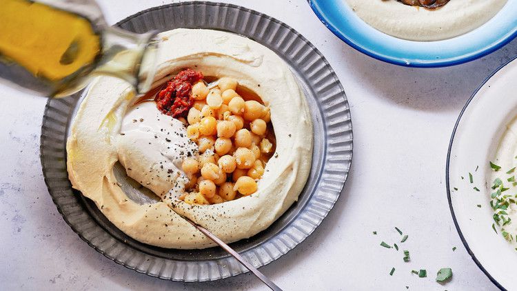mixing perfectly balanced hummus