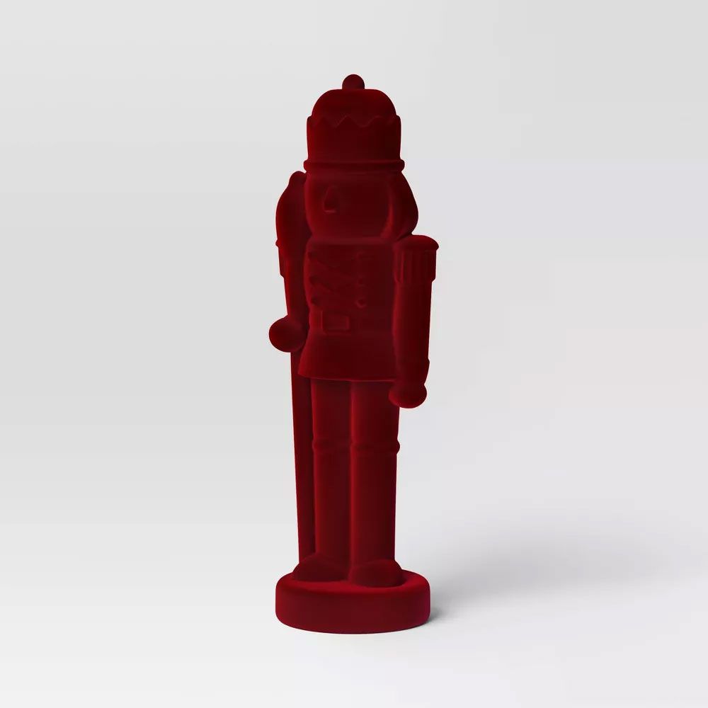 Red flocked Christmas nutcracker