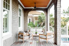 Wooden porch with seating and table