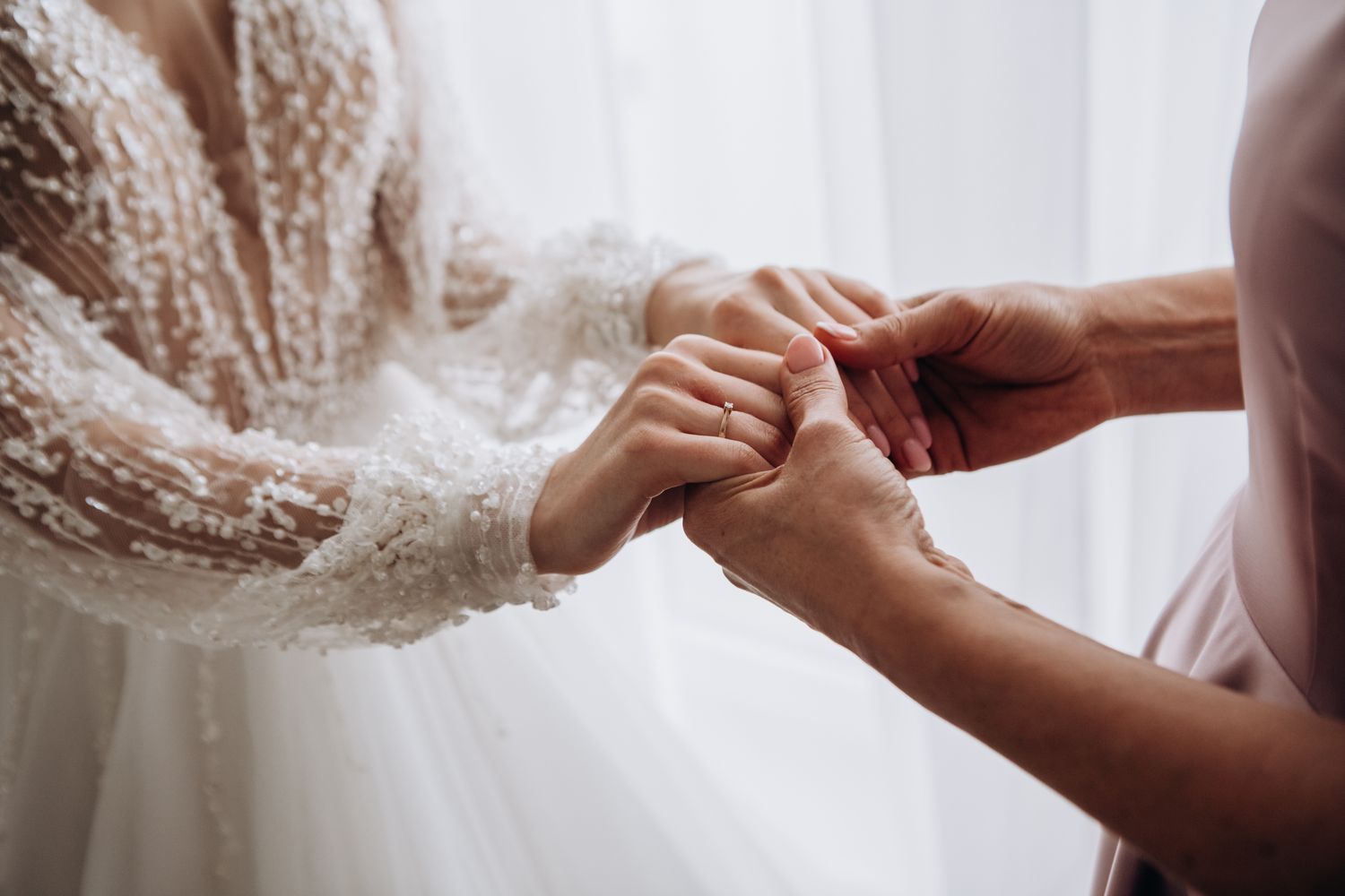 Bride holding hands with another individual personal interaction