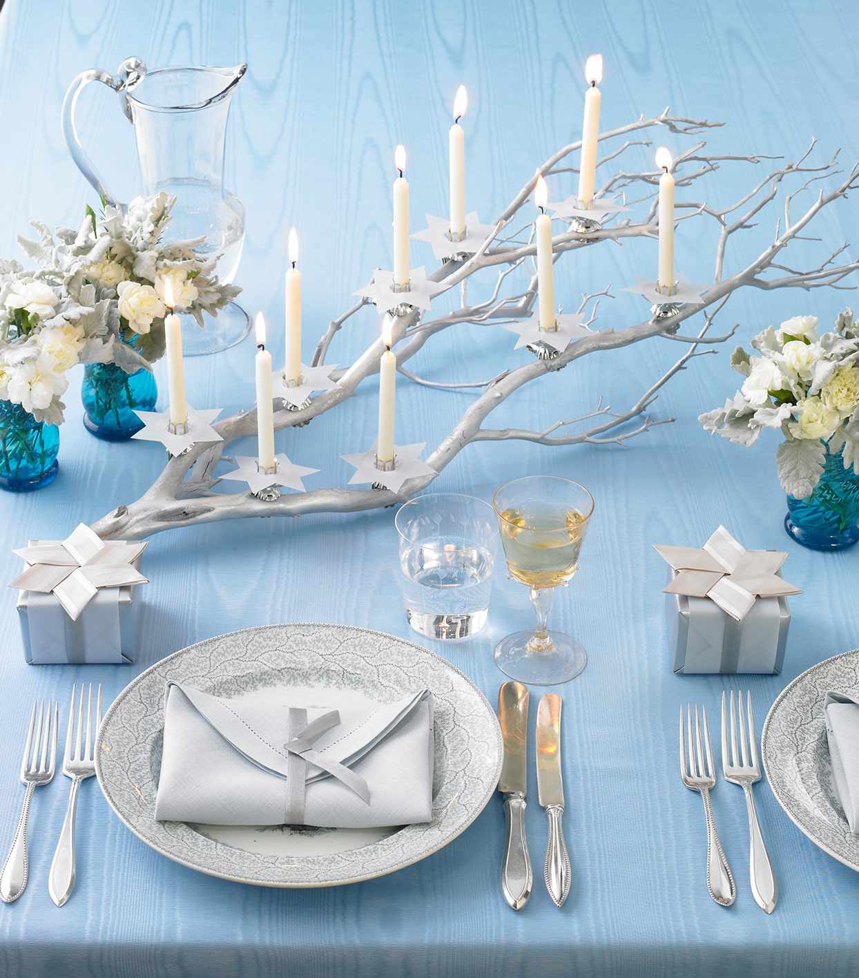 blue and silver themed hanukkah table setting