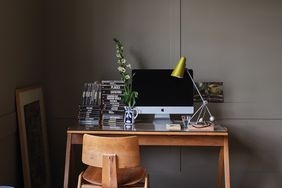 wooden desk in brown-painted at home office