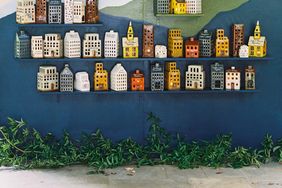 Wall of ceramic houses for guests to take home