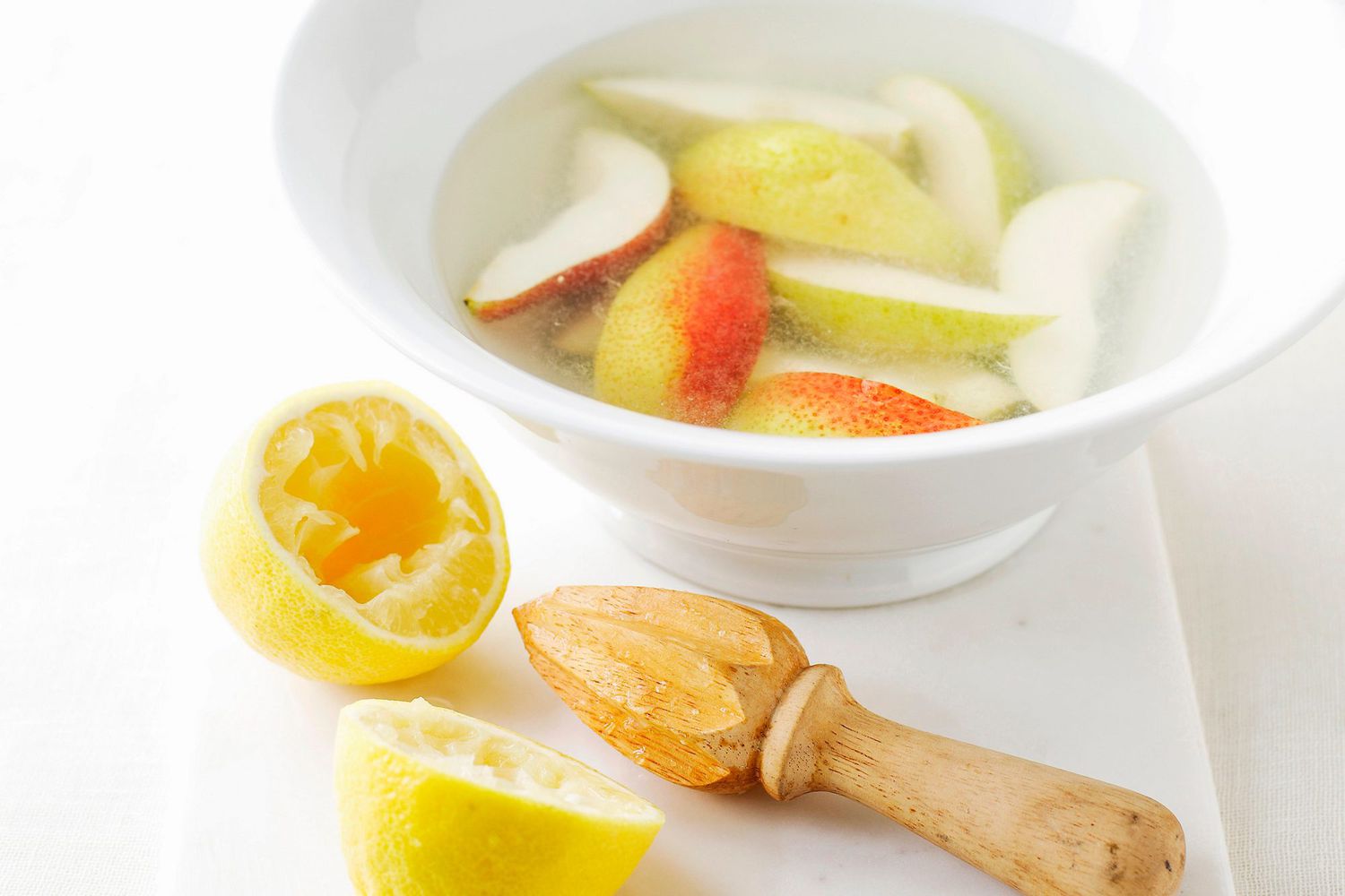 Bowl of apples in lemon juice to keep from browning