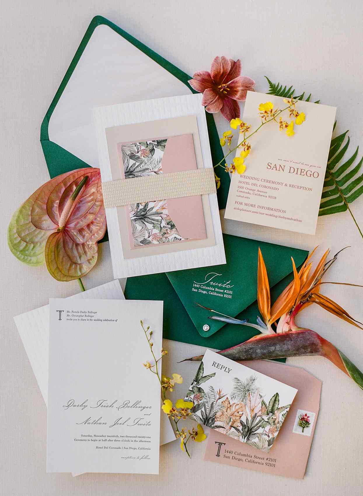 wedding invitation suite with pink and green accents