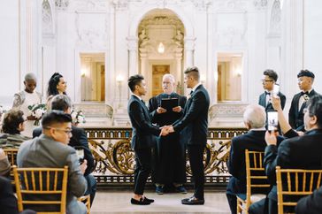 grooms during wedding ceremony at city hall